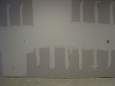 A taped and floated new drywall wall