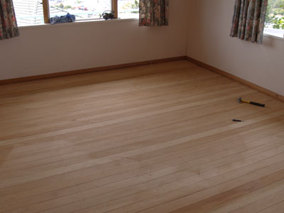 Refinishing a hardwood floor, photo courtesy Stug