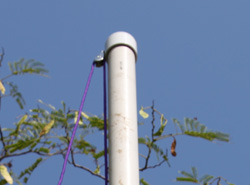 Awning pulleys attached to the top flagpole section; photo courtesy Kelly Smith