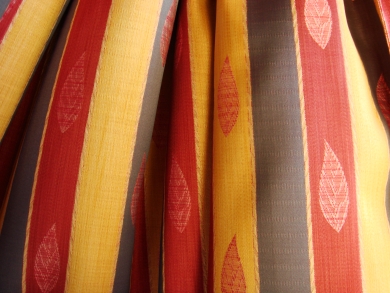 Curtains with a red leaf pattern for a fall window treatment