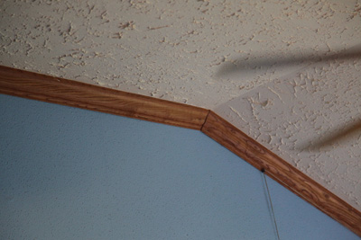 Red oak crown molding adds bling to your living room, photo courtesy of Kelly Smith